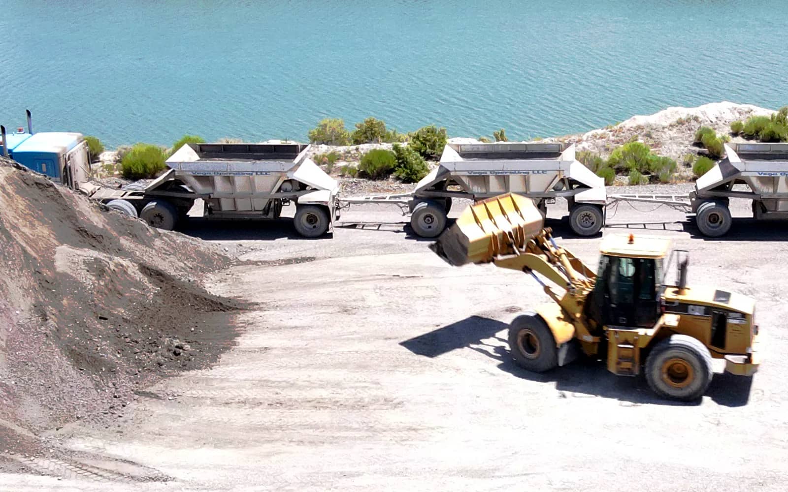 Loader loading a belly dump truck