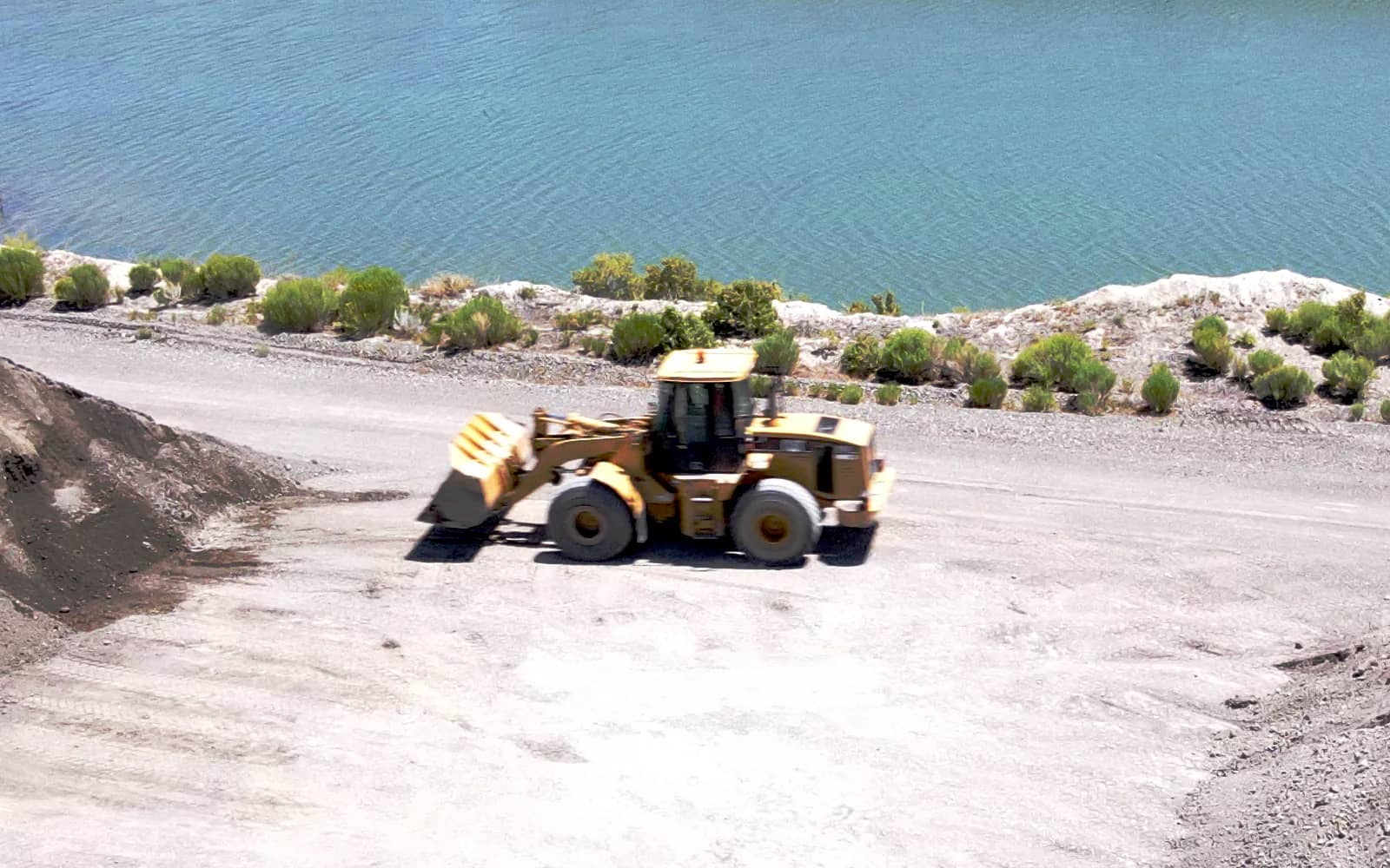 Loader waiting for dump truck to position