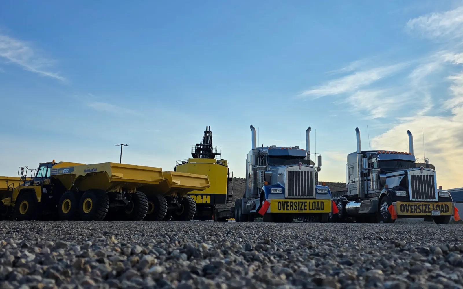 Semi-truck preparing to load a Komatsu underground unit