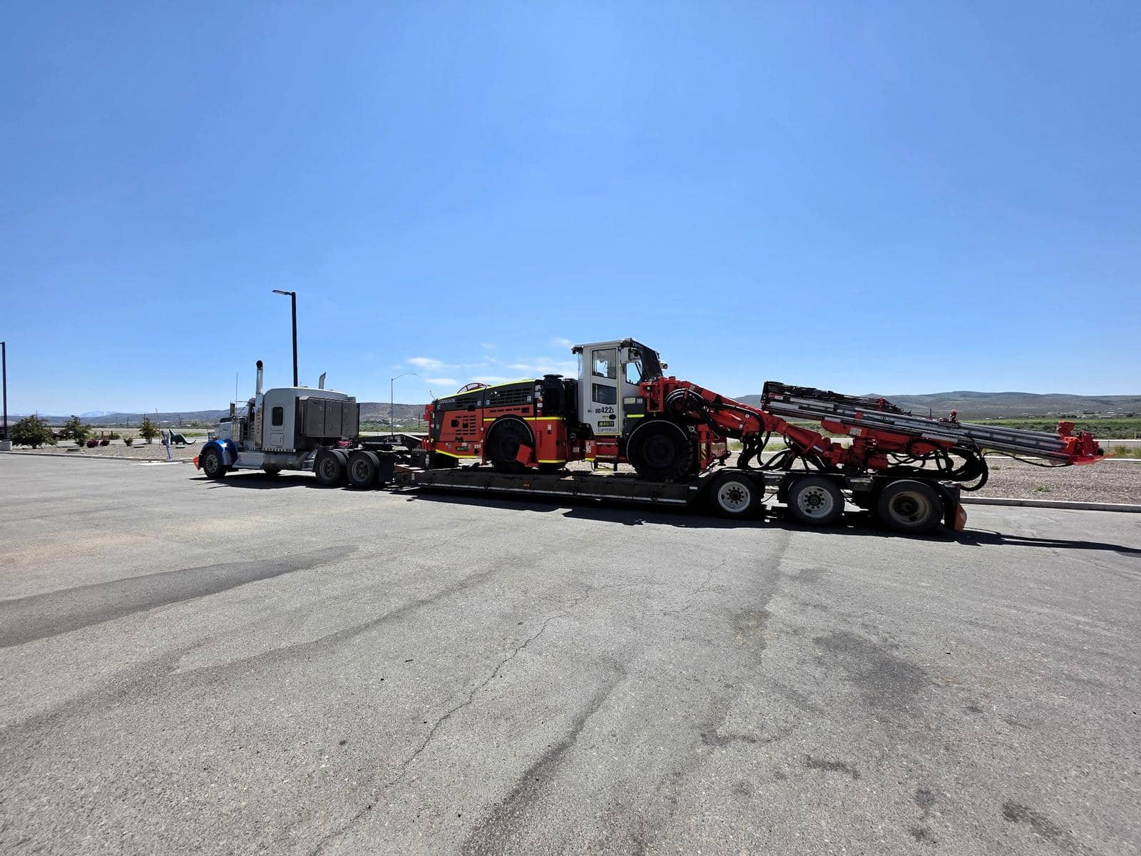 Heavy-haul tractors staged for transport